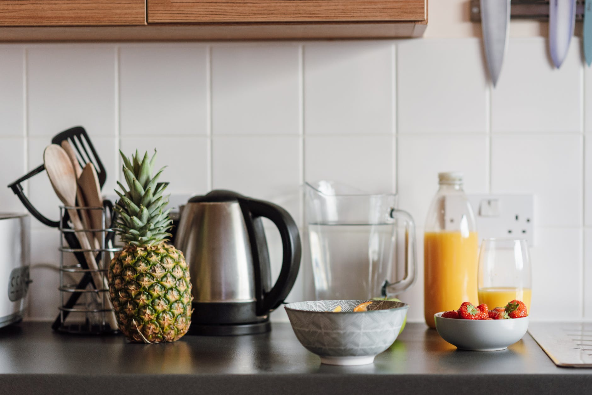 kitchen table with fruits and juice